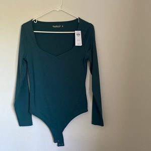 Long sleeve green body suite with clasps